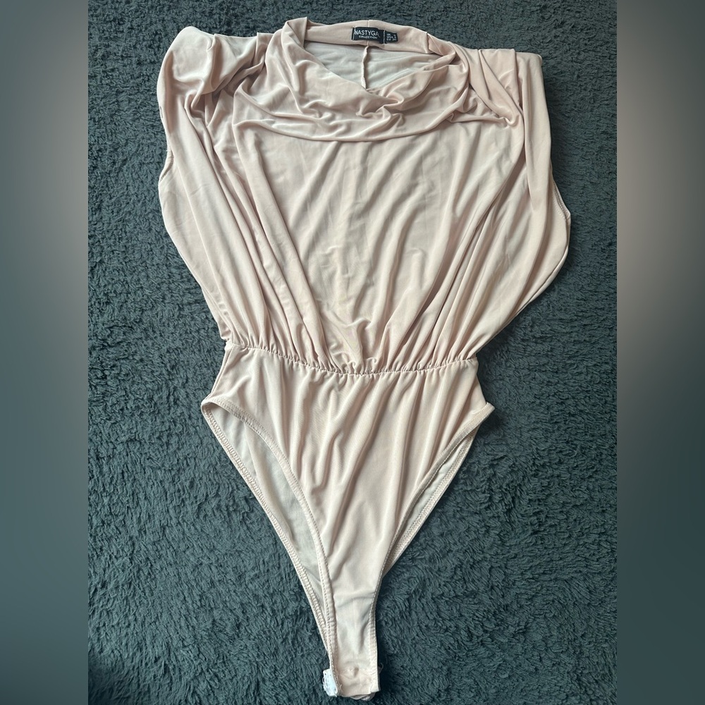 Lt pink Nasty Gal bodysuit, foam shoulders and drapey neck-excellent condition